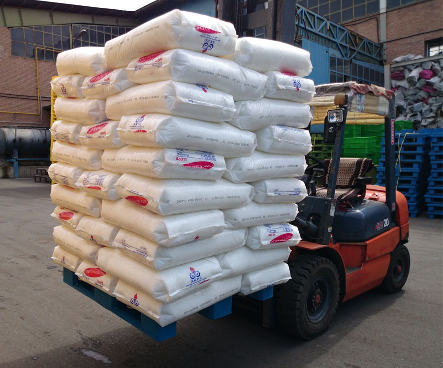 a forklift is moving heavy-duty cargo with help of a plastic pallet 