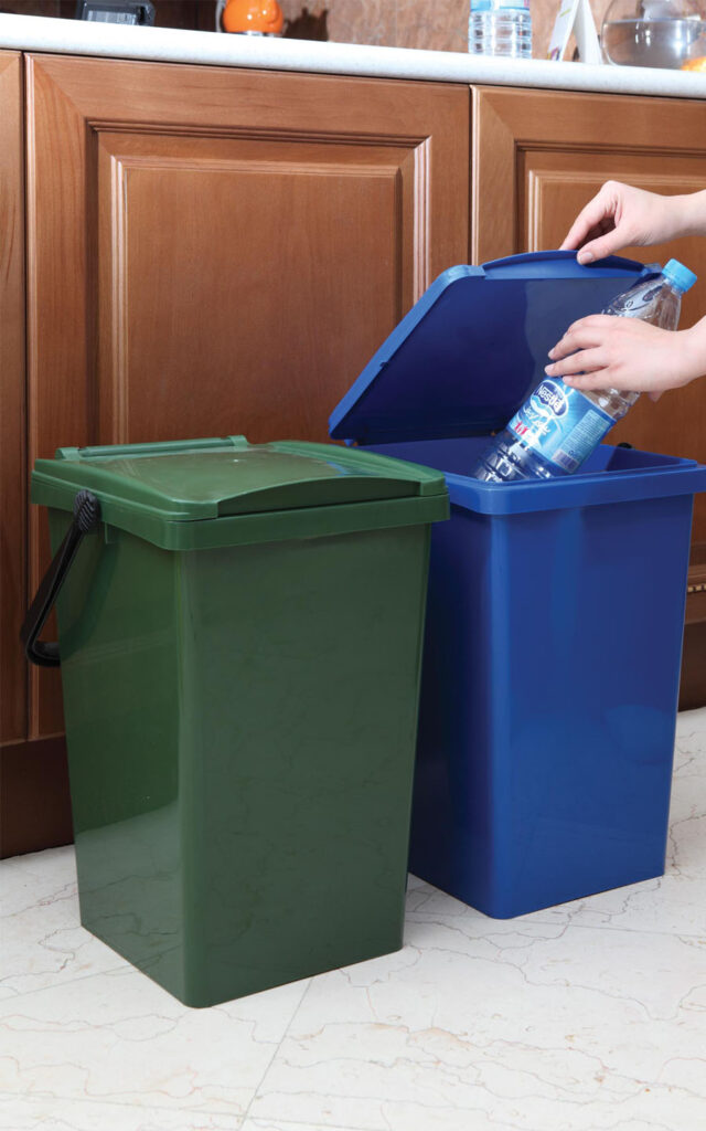 putting an empty Nestle bottle in a litter bin 