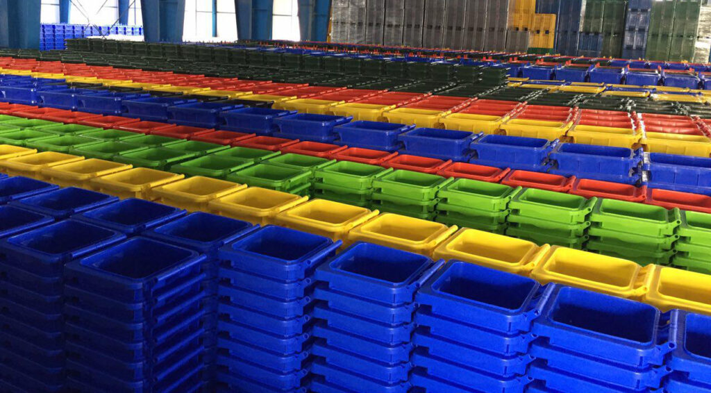 there is a large warehouse full of plastic waste bins with different sizes and colors 