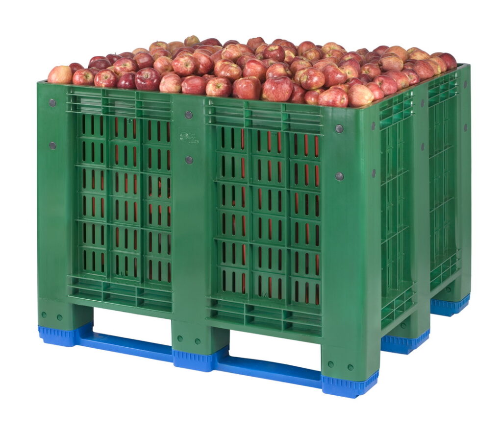 The picture shows perforated box pallet full of fruits (apple)