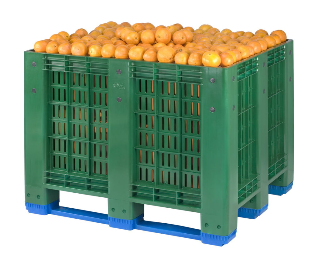 The picture shows perforated box pallet full of fruits (oranges)