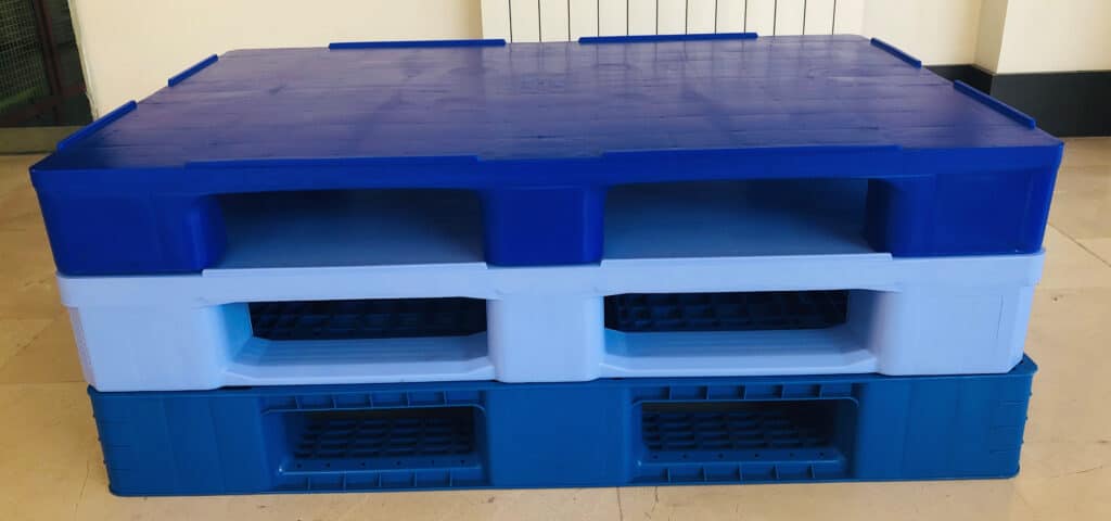 The photos describe a pile of three plastic pallets made of PP Copolymer injection grade material produced  through the injection molding method in three different shades of Blue colors.